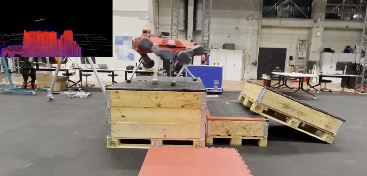 ANYmal quadruped climbing onto stacked pallet boxes, with its height map shown in an inset